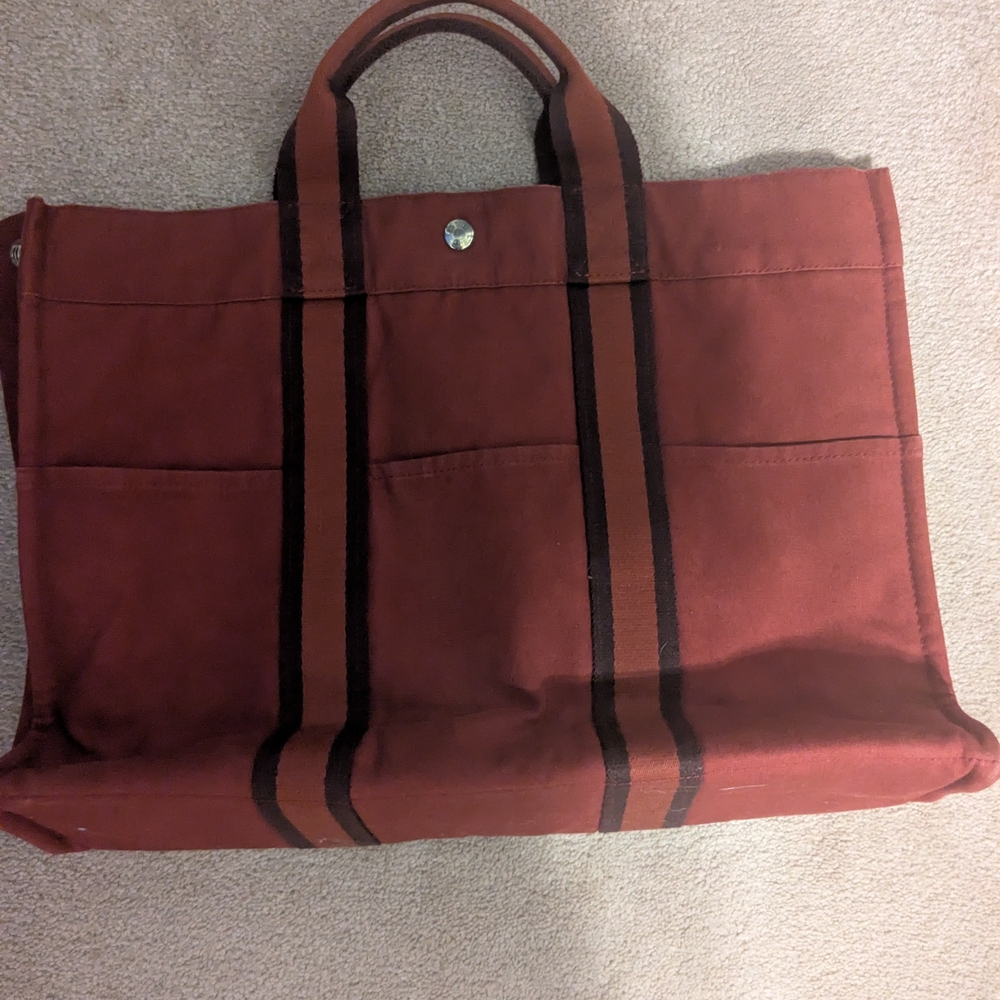 Red canvas Hermès Fourre Tout MM tote bag with striped handles